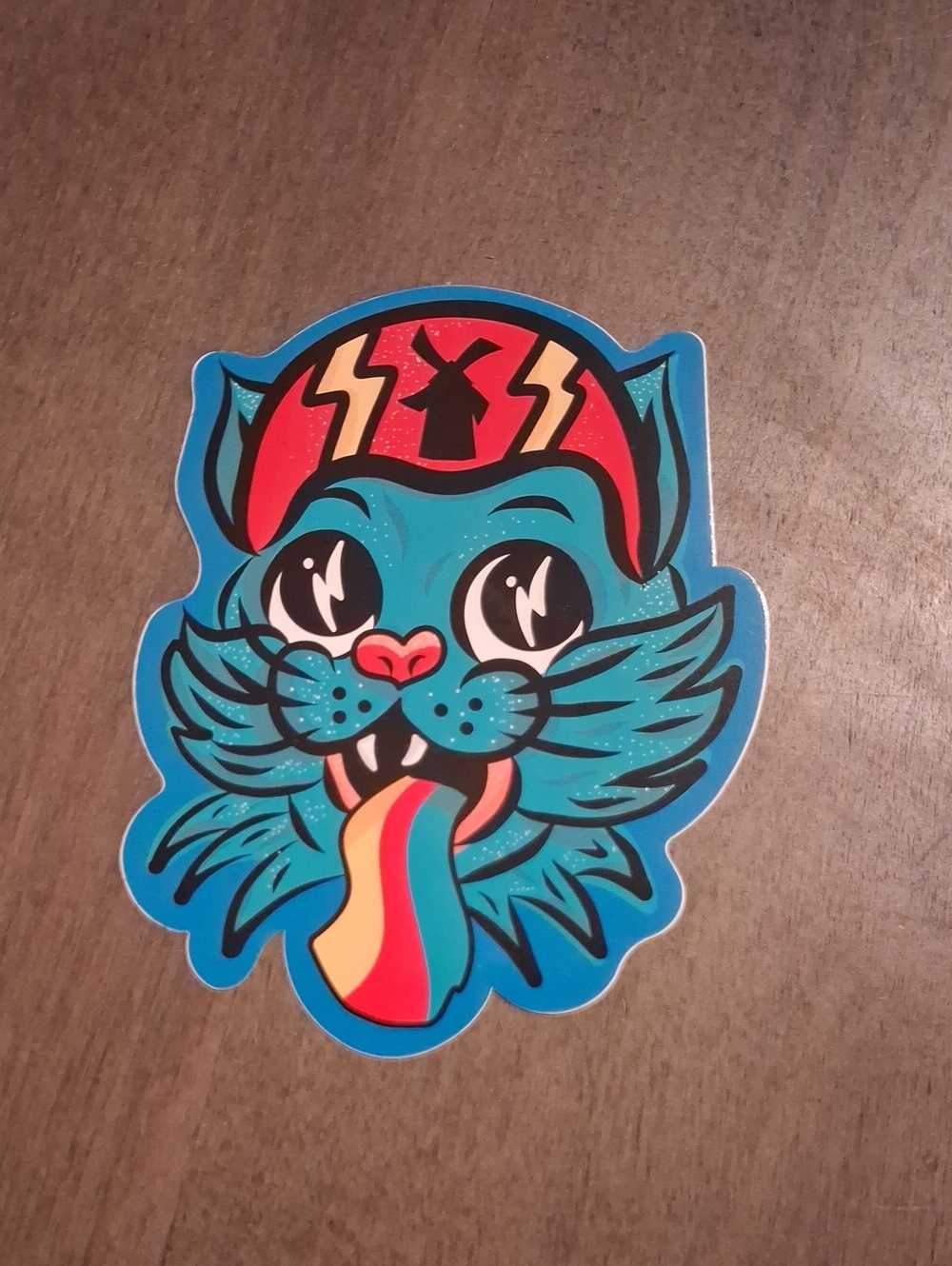 Dutch Bros Teal Cat Sticker with Rainbow Tongue